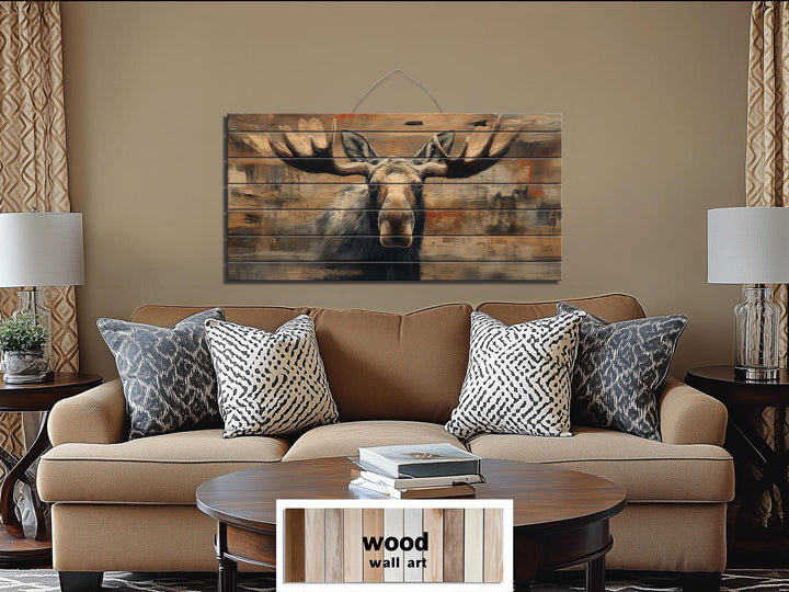 Large horizontal wood wall art featuring a realistic moose portrait on rustic timber planks.