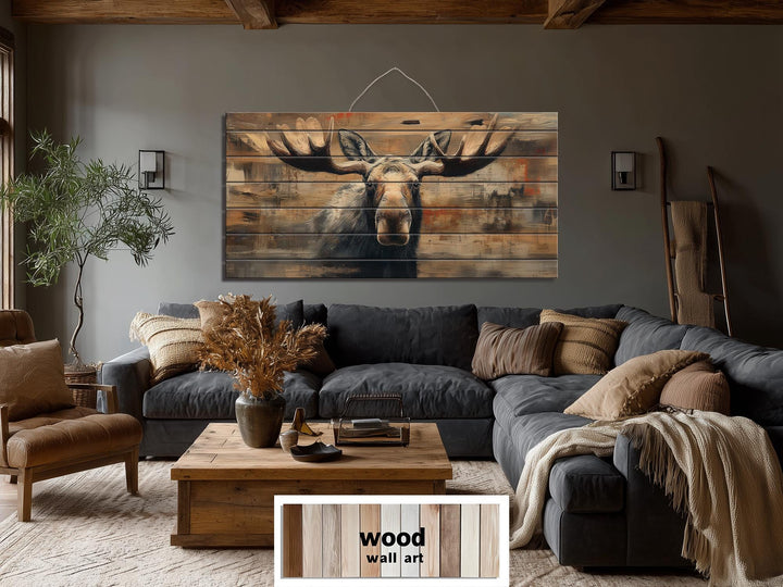 Large horizontal wood wall art featuring a realistic moose portrait on rustic timber planks.