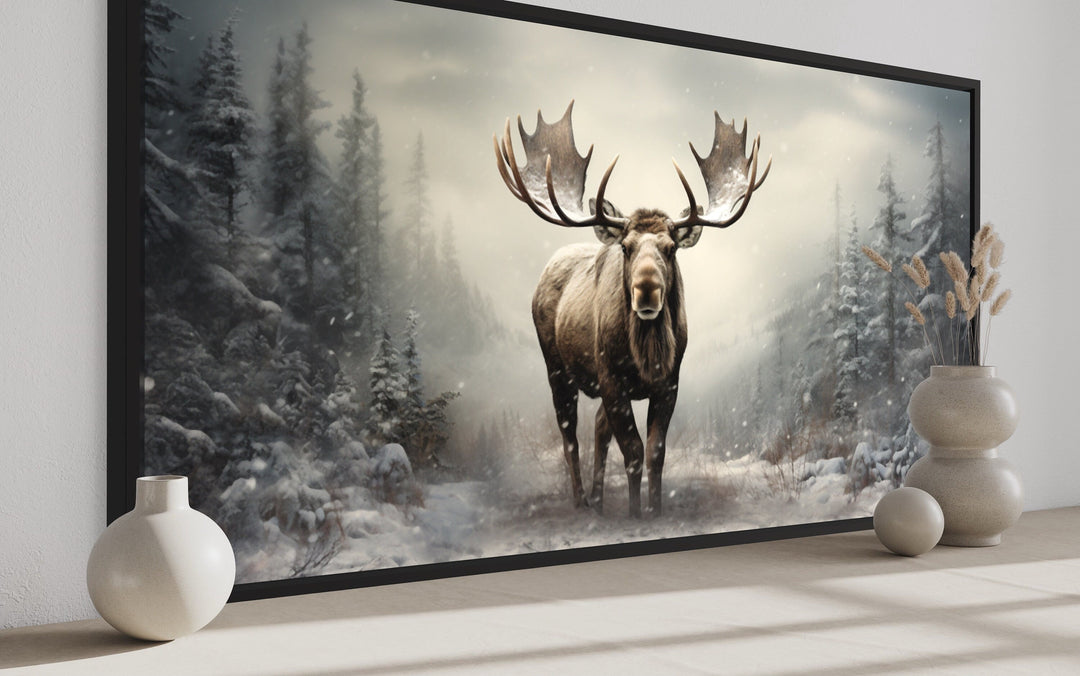 Framed canvas print of a majestic moose in a foggy, snow-covered winter forest.