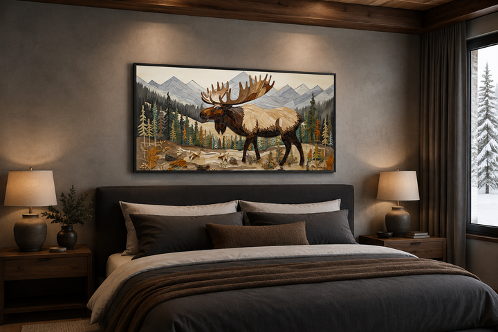 Framed moose wall art in a rustic bedroom above a bed with brown and grey bedding.