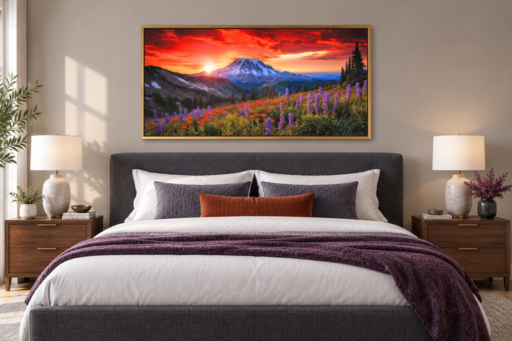 Mount Rainier wall art canvas print featuring a sunset over a wildflower field above a bed.