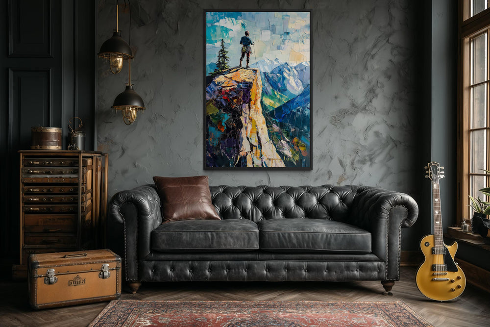 Vertical canvas print of a hiker on a cliff landscape displayed in a moody, modern living room.
