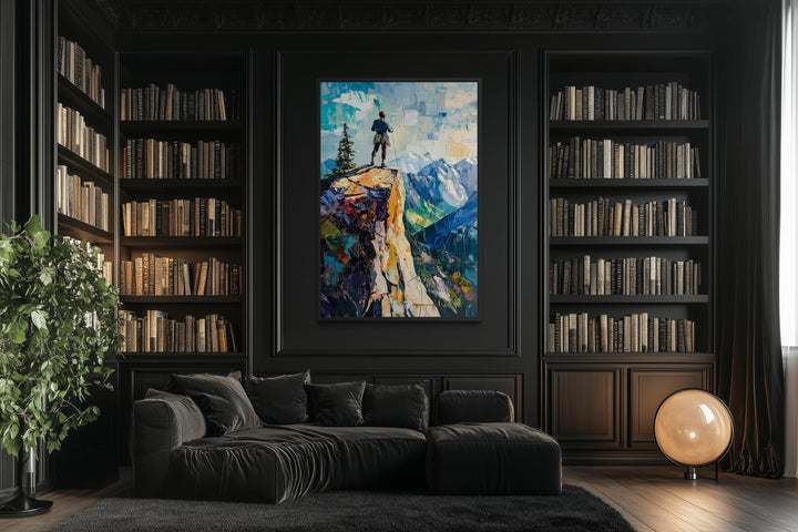 Vertical canvas print of a hiker on a cliff landscape in a dark, modern library setting.