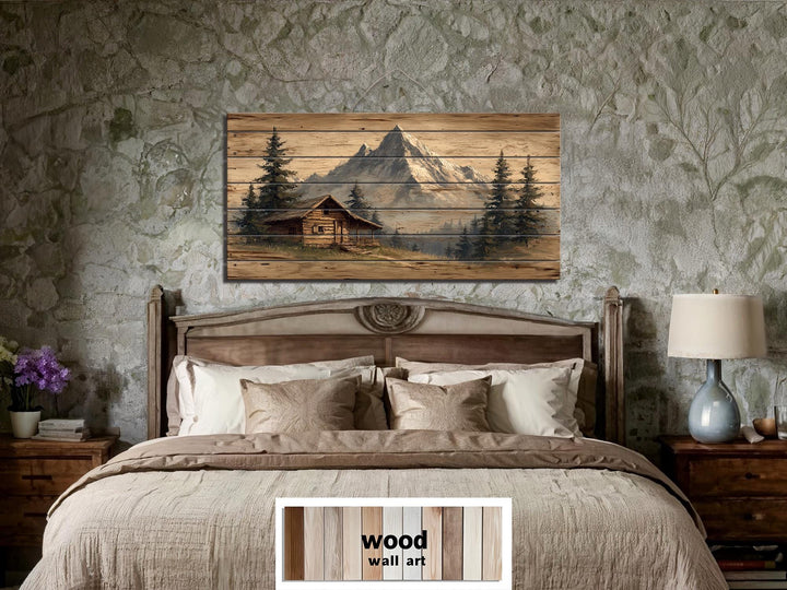 Mountain cabin distressed wood wall art with a log cabin and mountain scene.