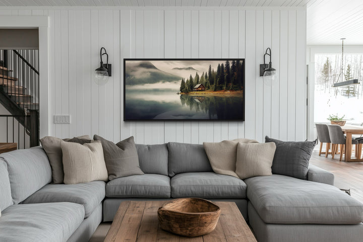 Mountain Cabin On The Lake Large Summer Landscape Framed Wall Art above a grey sectional sofa.
