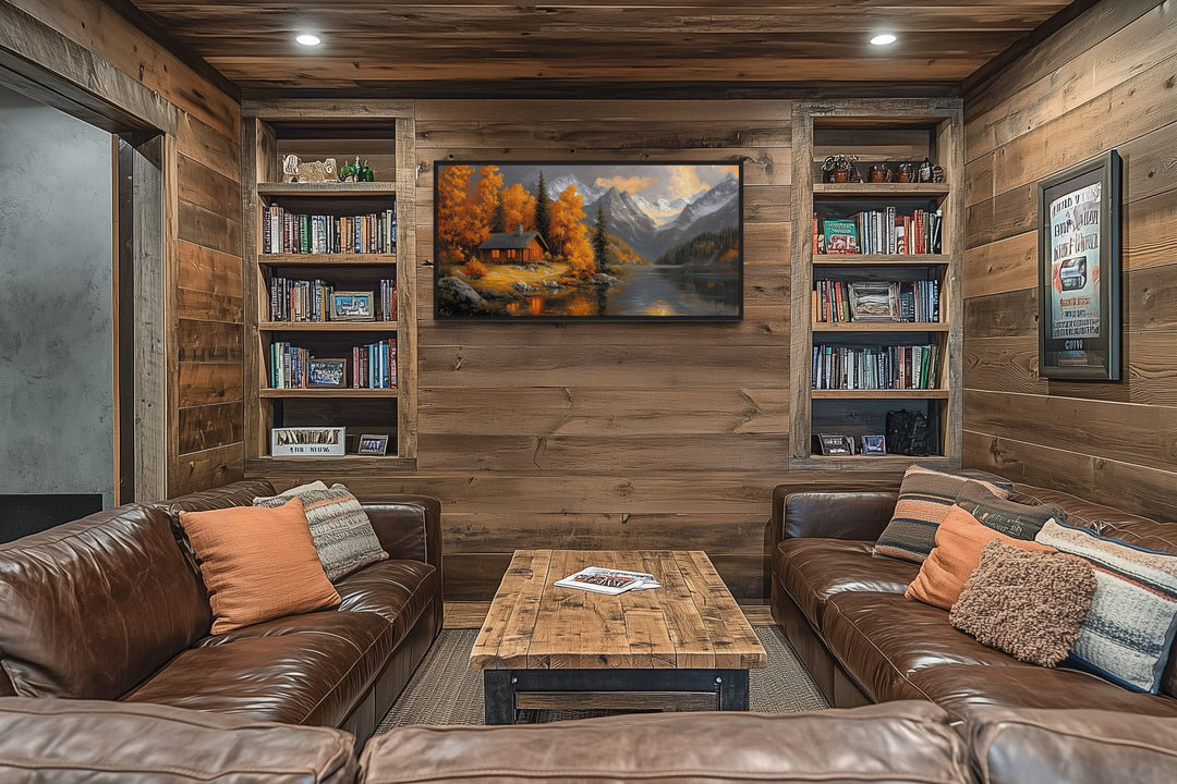 Rustic mountain cabin canvas art with autumn colors displayed in a cozy wood-paneled living room.