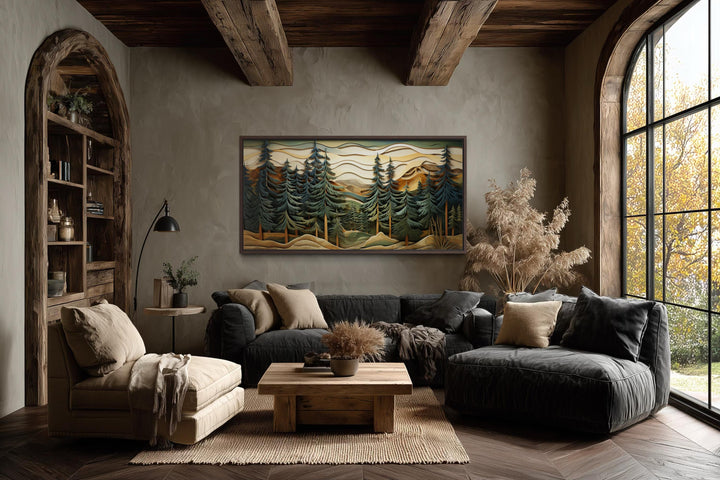Panoramic mountain forest canvas wall art featuring layered pine trees in a rustic cabin living room.