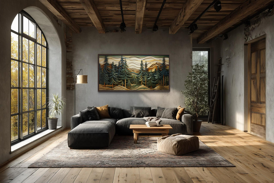 Panoramic mountain forest canvas wall art with pine trees in a rustic, industrial living room.