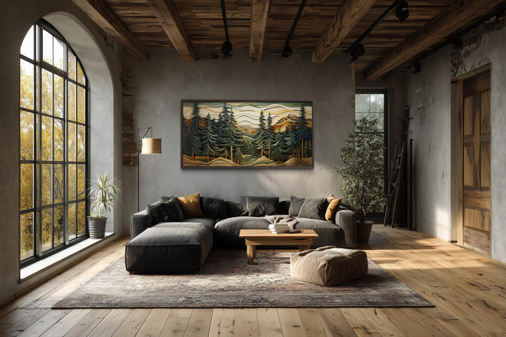 Panoramic mountain forest canvas wall art with pine trees in a rustic, industrial living room.