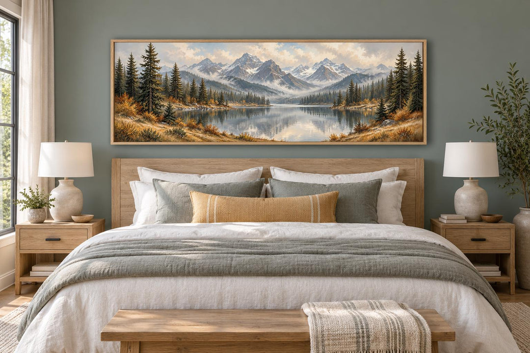 Mountain Lake and Autumn Forest long horizontal canvas wall art hanging above a wooden bed frame.