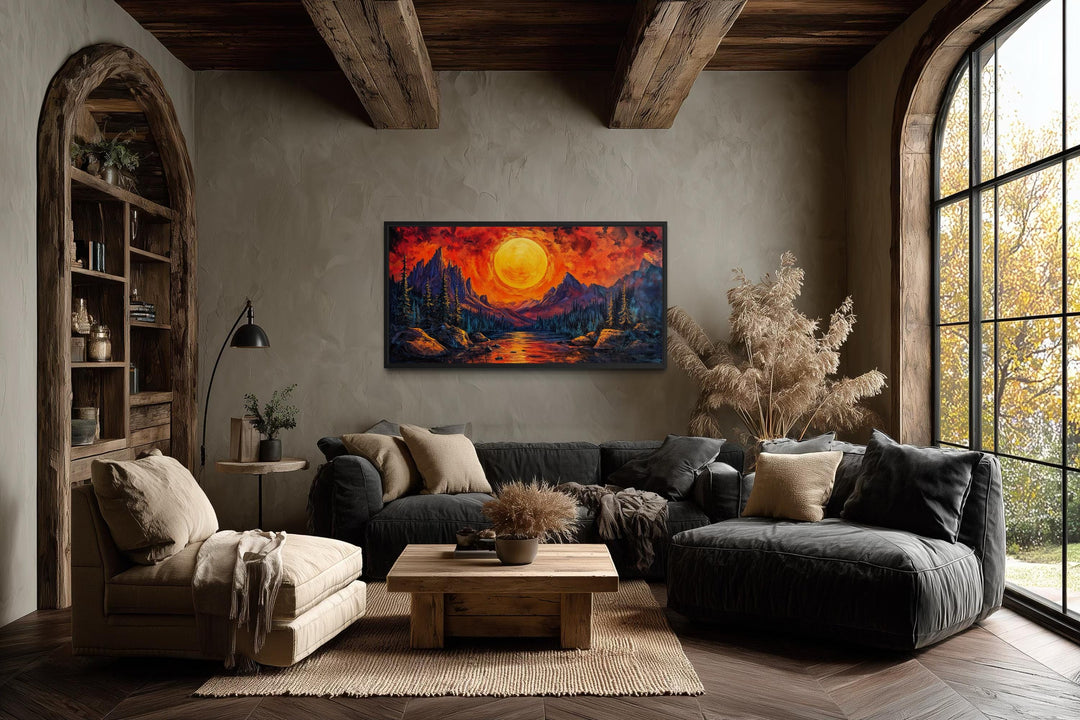 Mountain Lake Fiery Sunset canvas wall art in a modern living room with rustic wooden beams.