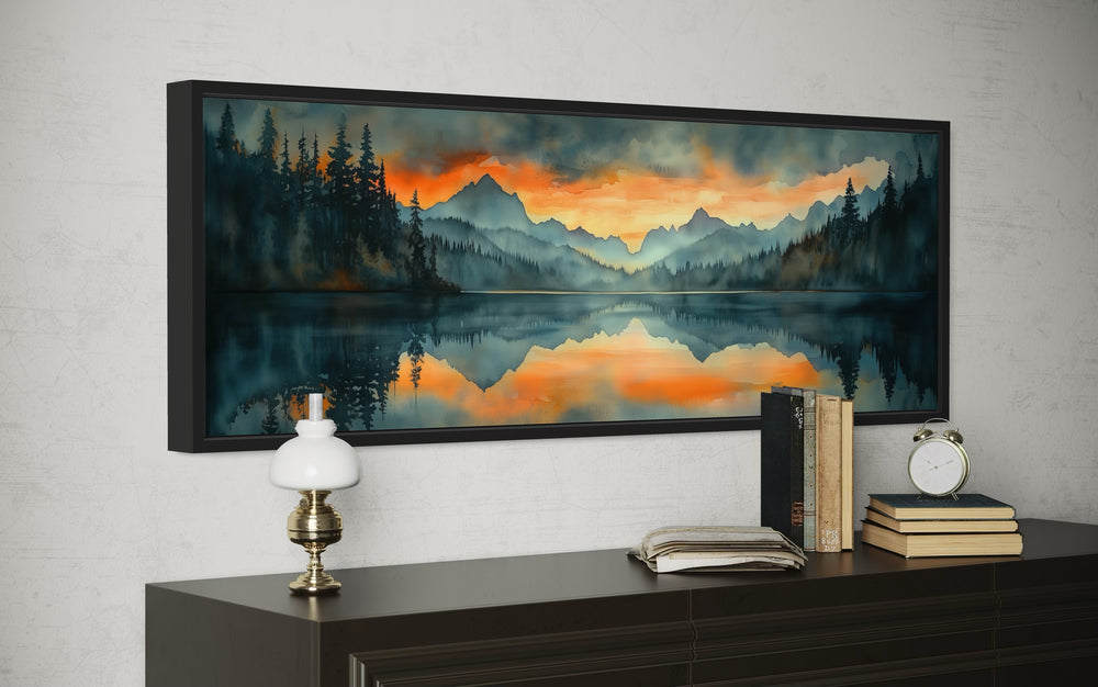 Horizontal watercolor wall art of a mountain lake sunset above a dark wood dresser.