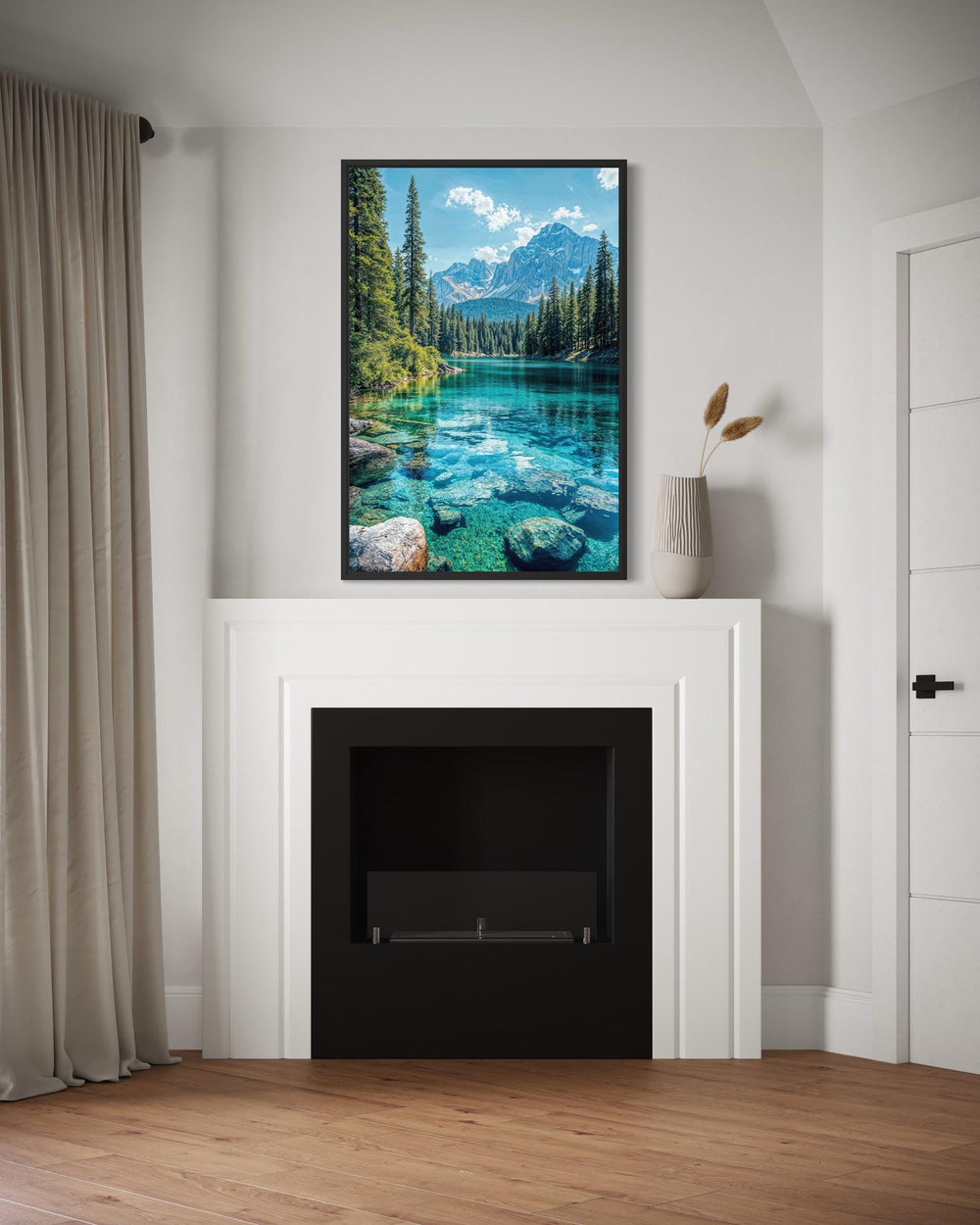 Vertical canvas wall art of a mountain lake scene hanging above a modern white fireplace.