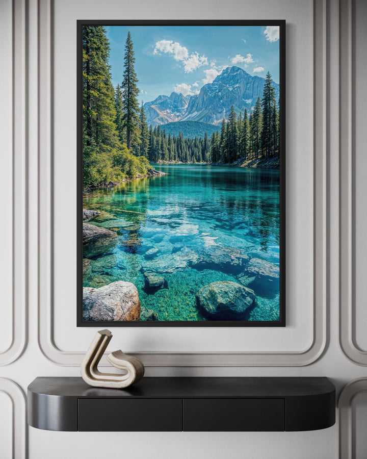 Vertical canvas wall art of a clear turquoise mountain lake surrounded by evergreen trees.