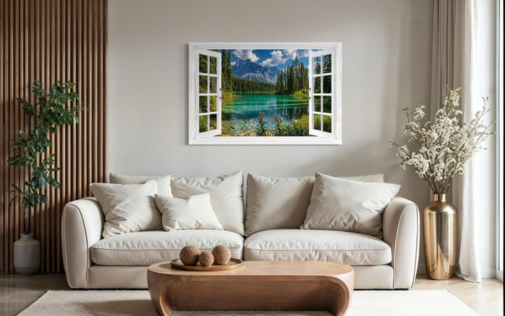 Mountain lake window view canvas wall art depicting a turquoise alpine lake in a white window frame.