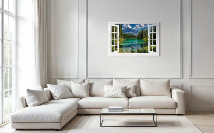 Mountain lake window view canvas wall art featuring a turquoise alpine lake and snowy peaks.