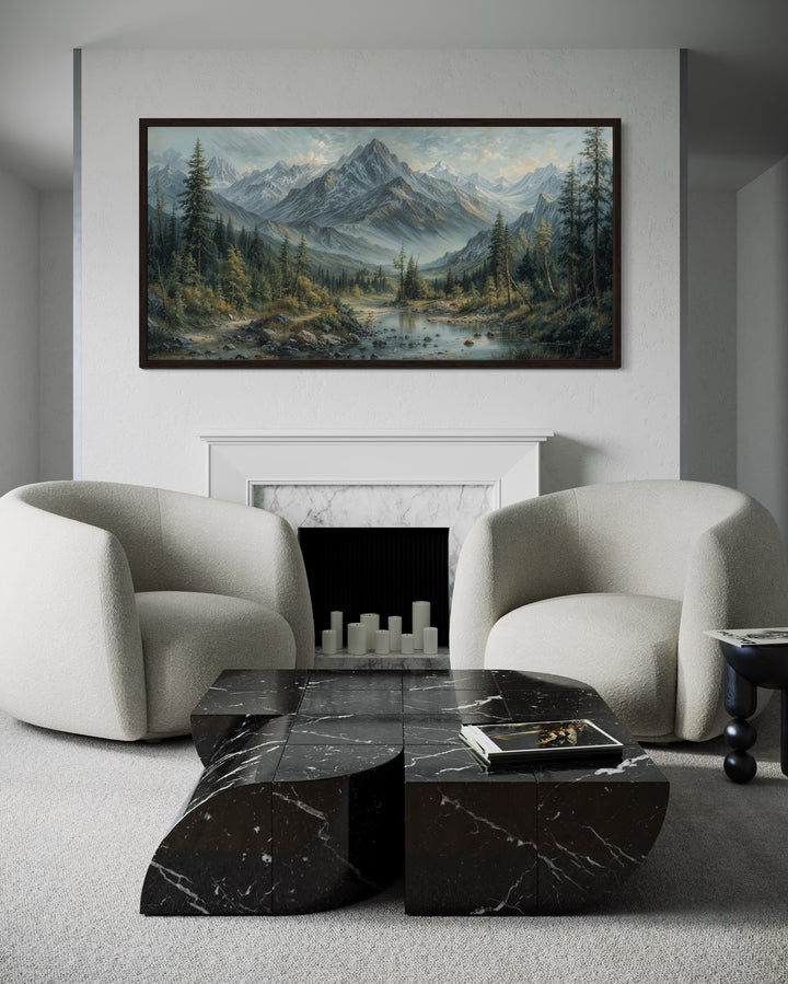 Mountain river landscape framed canvas art above a white fireplace in a modern living room.