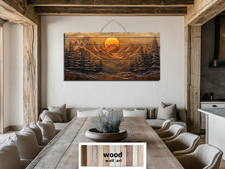 Rustic wood wall art featuring a mountain sunset and pine forest scene above a dining table.