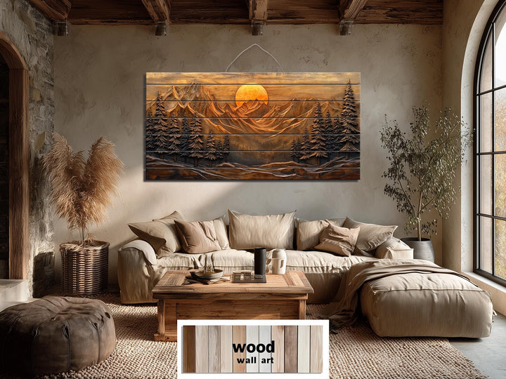Mountain sunset pine forest rustic distressed wood wall art hanging in a cozy living room.