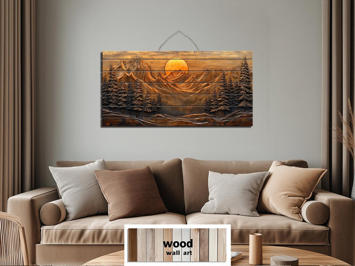 Rustic wood wall art featuring a carved mountain sunset and pine forest scene above a tan sofa.