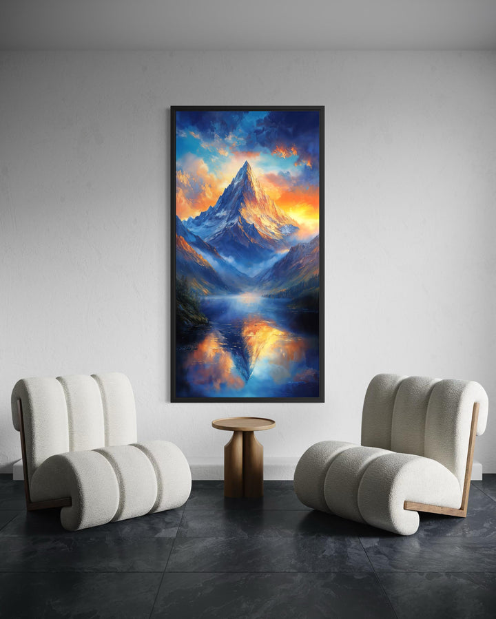 Vertical mountain sunset canvas print with blue and orange sky reflection in a modern room setting.
