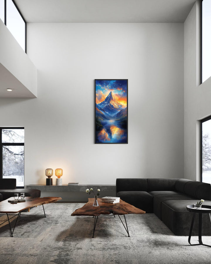 Vertical canvas print of a mountain sunset with blue and orange sky reflections in a modern room.
