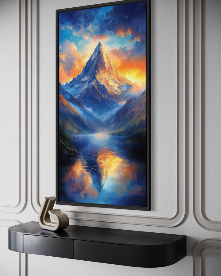 Vertical mountain sunset canvas print with blue and orange sky reflected in a calm lake.