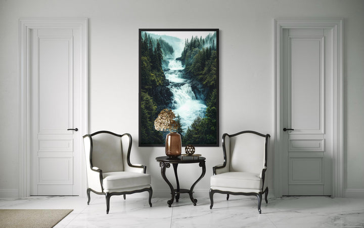 Vertical canvas print of a rushing mountain waterfall surrounded by a dense pine forest.