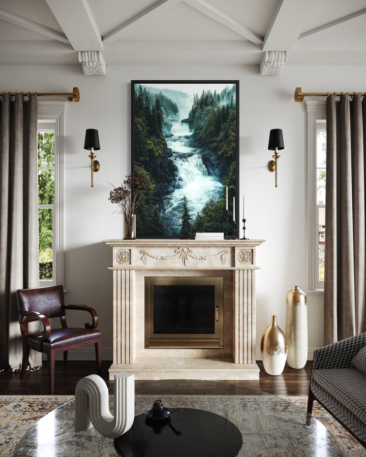 Vertical canvas print of a rushing mountain waterfall through a dense pine forest above a fireplace.