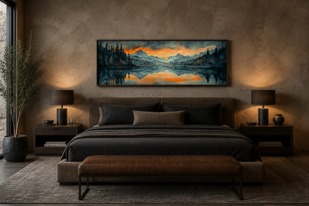 Horizontal watercolor painting of a mountain lake sunset hanging above a bed in a modern bedroom.