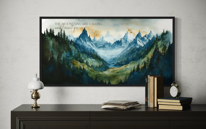 Framed watercolor mountain landscape art with the quote "The mountains are calling and I must go."