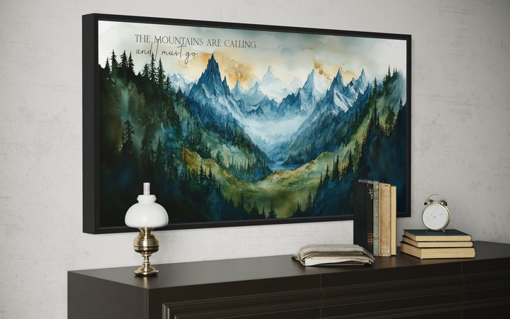 Framed watercolor mountain landscape wall art with the quote The mountains are calling and I must go