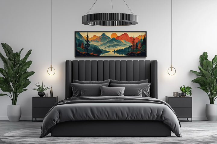 Horizontal mid-century modern canvas wall art of a mountain landscape above a dark gray bed.
