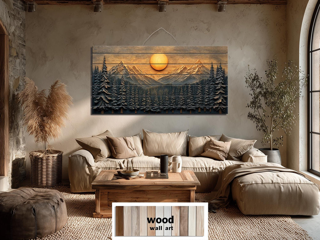 Mountains and forest sunset distressed wood wall art hanging above a sofa in a rustic living room.