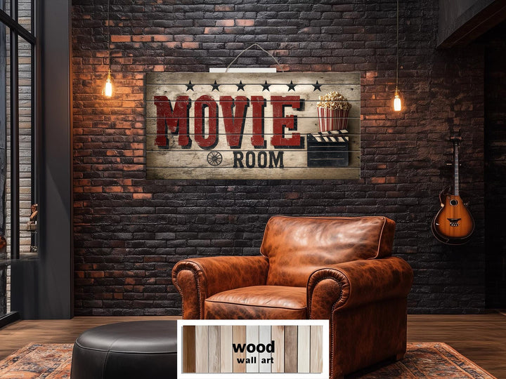 Rustic wood movie room wall art with a distressed finish hanging on a dark brick wall.