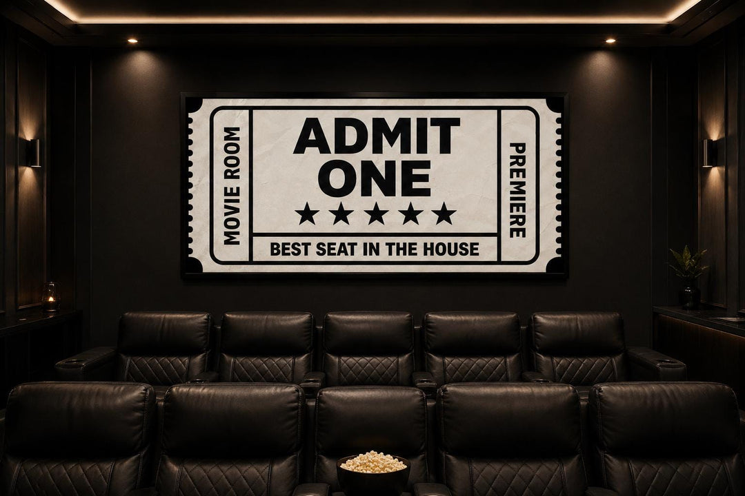 Vintage-style Admit One movie ticket canvas wall art in a black home theater room.