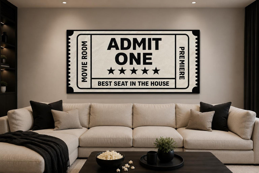 Vintage-style movie ticket canvas wall art above a beige sectional sofa in a home theater room.