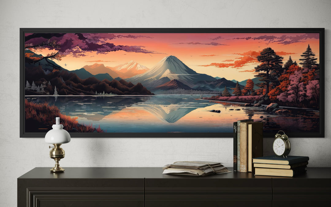 Horizontal framed canvas wall art of Mt. Fuji and Lake Kawaguchiko at sunset above a dark sideboard.