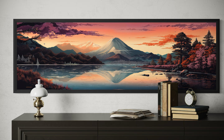 Horizontal framed canvas wall art of Mt. Fuji and Lake Kawaguchiko at sunset above a dark sideboard.