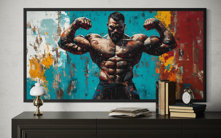A framed canvas print of a muscular man flexing against a vibrant, abstract painted background.