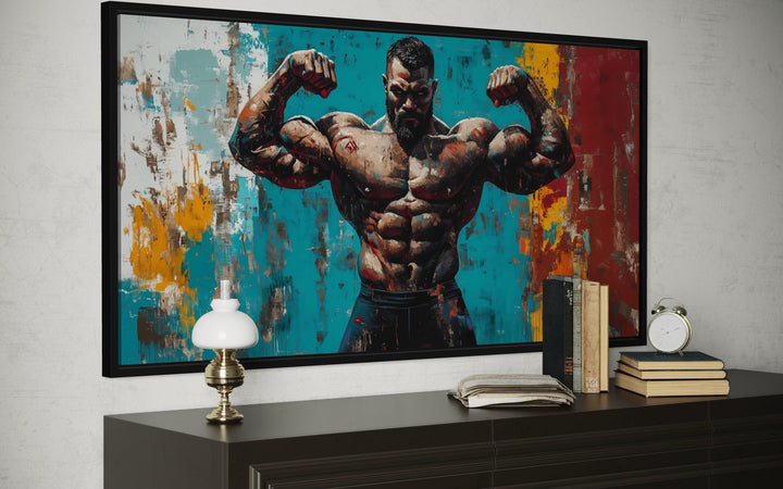 A framed canvas print of a muscular man flexing against a colorful, abstract background.