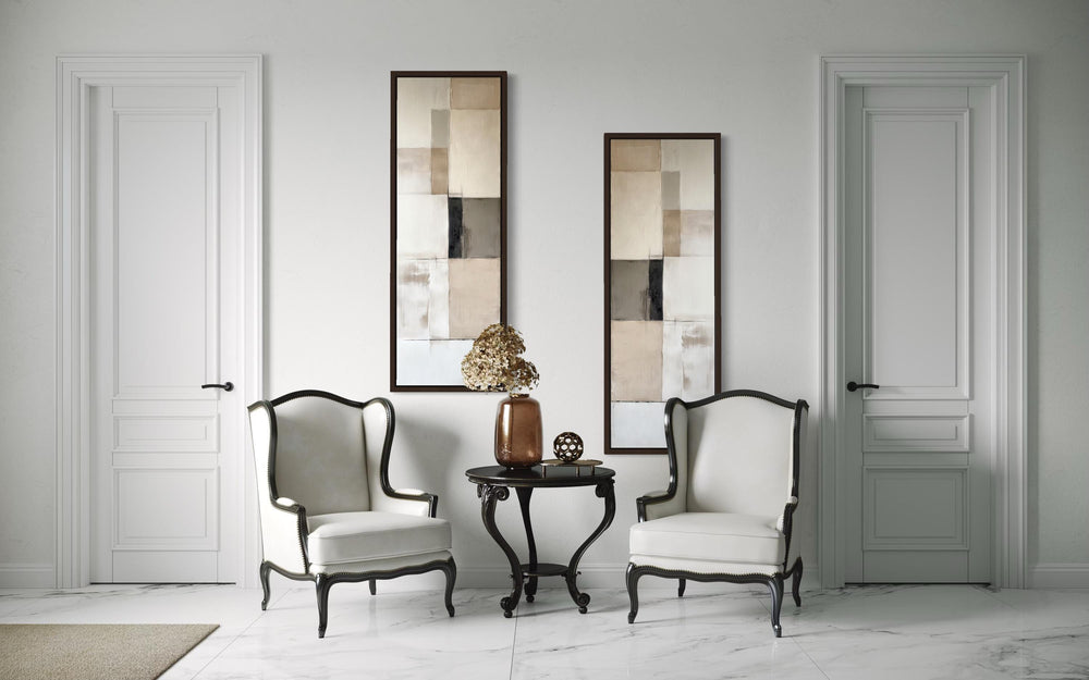 Two tall, narrow canvas prints featuring neutral geometric abstract blocks in a modern room.