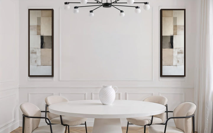 Two tall, narrow canvas prints with neutral geometric blocks flank a white wall in a modern room.