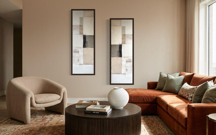 A pair of tall, narrow geometric abstract canvas prints in neutral tones with slim black frames.