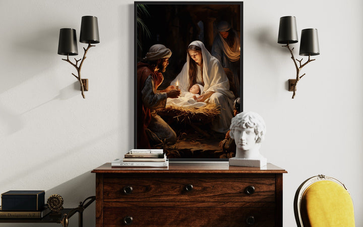 Framed canvas art of the Nativity scene with Mary, Joseph, and baby Jesus.