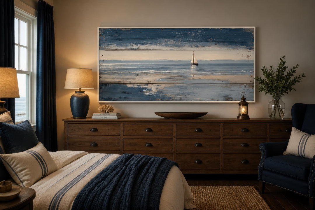 Nautical wall art featuring a lone sailboat on a calm ocean with a distressed wood-look finish.