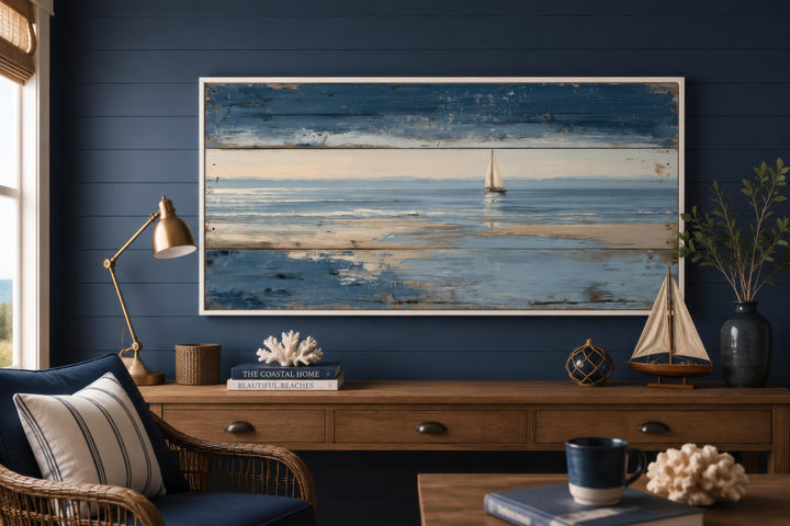 Nautical wall art featuring a lone sailboat on a calm ocean with a distressed wood-look finish.