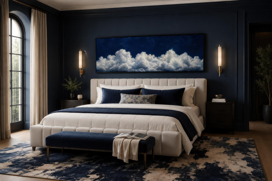 Navy blue cloud wall art canvas print displayed above a bed in a dark navy bedroom.