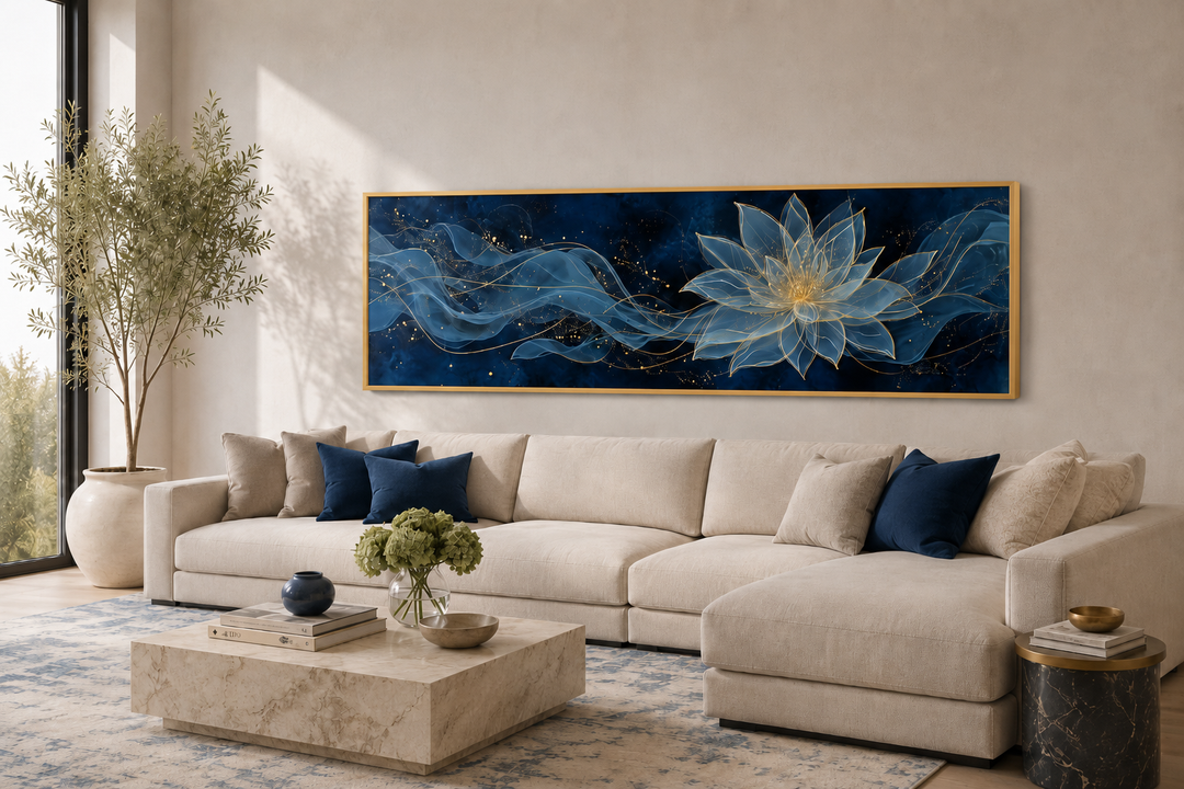 Navy blue and gold minimalist lotus flower canvas wall art hanging above a beige sectional sofa.