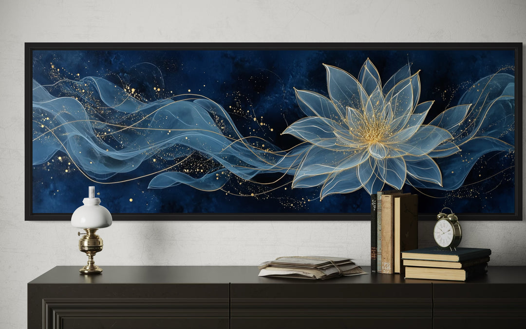 Navy blue and gold minimalist lotus flower canvas wall art above a dark wood console table.
